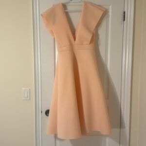 Nice pretty little things dress in size 10 never been worn still has the tag